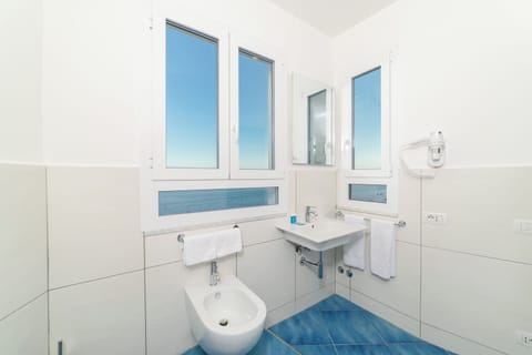 Deluxe Room, 1 Queen Bed, Balcony, Sea Facing | Bathroom | Rainfall showerhead, hair dryer, slippers, bidet