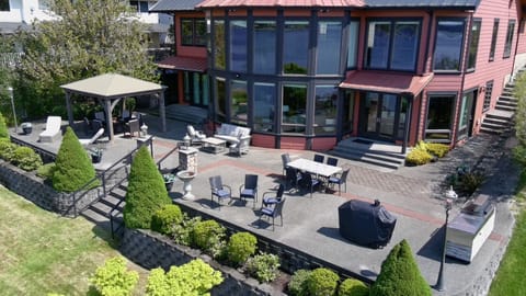 Main House back deck offers plenty of seating to take in views and enjoy a grilled meal