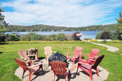 Backyard with outdoor fireplace and lake access