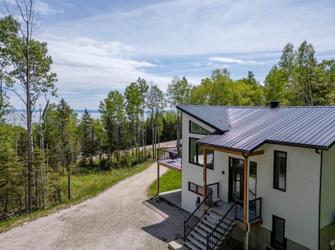 Entrance to the chalet and view of the river, summer