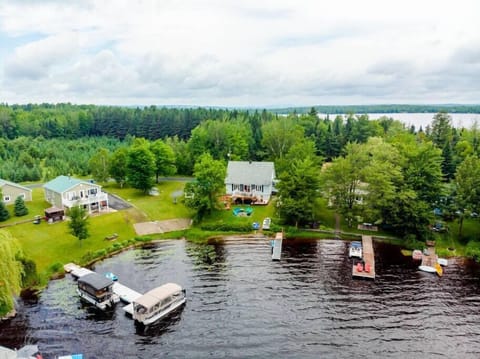 Aerial view of the chalet, lake and neighborhood