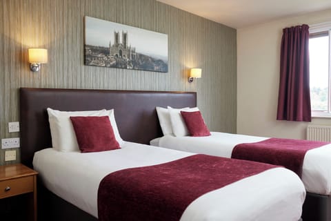 Twin Room | Desk, blackout drapes, iron/ironing board, free cribs/infant beds