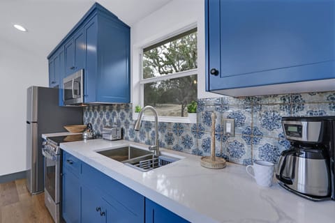 Dual sink and plenty of counter space to prepare meals.