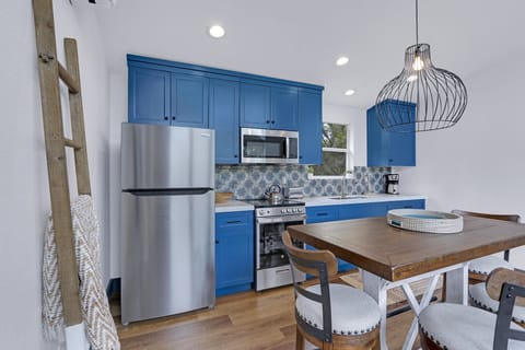 Dining table and kitchen beyond.