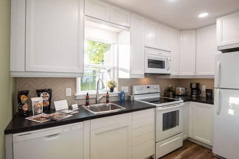 Your fully equipped kitchen awaits with modern appliances, sleek countertops, and everything needed to prepare your favorite meals in comfort.