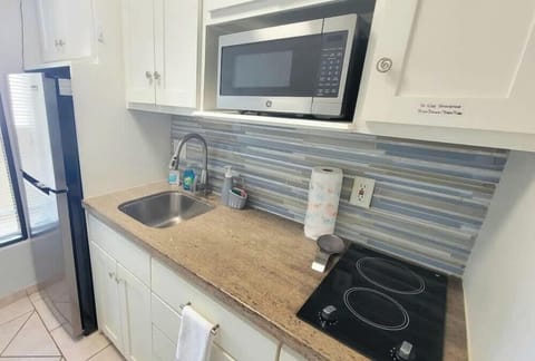 Condo, 1 King Bed with Sofa bed, Balcony | Private kitchen | Fridge, microwave, stovetop, coffee/tea maker