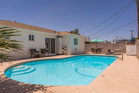 Private backyard with pool, bbq and patio seating