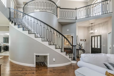 Circular stair case to the 2 upstairs bedrooms with balcony overlooking the living room.