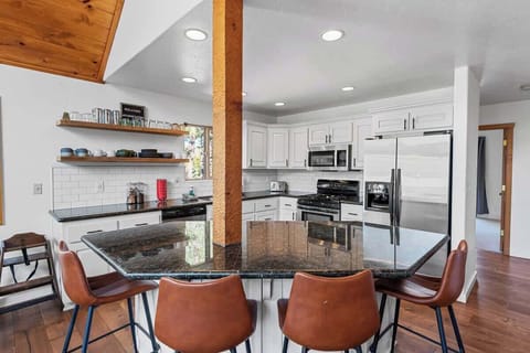 Open kitchen area with bar seating. 