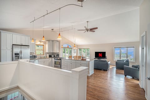 With peek-a-boo lake views, a spacious wraparound deck with grill, and room for up to 10 guests, this 4-bedroom cottage is perfect for families and groups