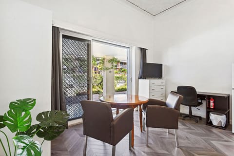 Relax and unwind in this comfortable living space, featuring plush seating and a view of the outdoors.
