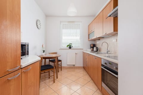 The kitchen features a stylish and functional design. 