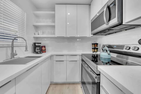 Modern kitchen offering ample storage and a suite of essential appliances