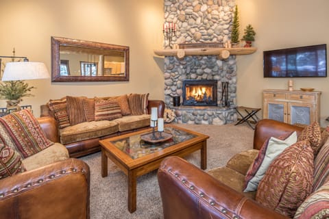 Living room with wood burning fireplace