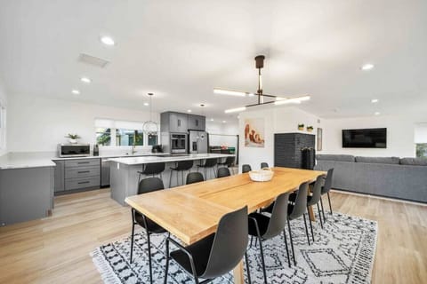 The combined dining, living room, and kitchen areas