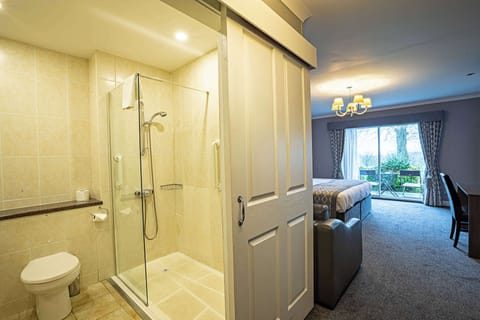 Desk, laptop workspace, blackout drapes, iron/ironing board