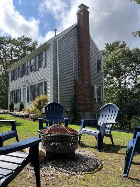 Front yard with fire pit and front entrance to house
