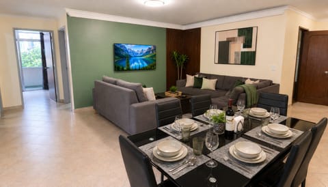 interior, indoor, couch, living area, television, dining table