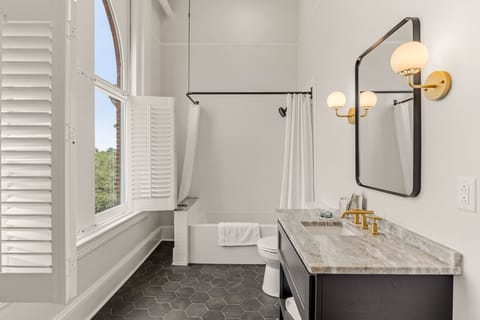 Romantic Suite | Bathroom | Deep soaking tub, designer toiletries, hair dryer, towels