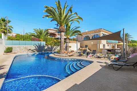 Beautiful holiday villa with private pool located in Calpe (Costa Blanca) for 4 people, with two bedrooms and a bathroom on one floor. It has air conditioning in the bedrooms.INTERNAL: This pleasant villa is arranged on the GROUND FLOOR which consists of a living-dining room with TDT TV and access to the pool area. An independent kitchen fully equipped with ceramic hob. Two bedrooms, one with a double bed and the other with two single beds. In addition to a bathroom with shower. The UPPER FLOOR is closed and uninhabited during the rental.EXTERNAL: Pleasant outdoor area with a spectacular 11.5 x 8 pool with Roman steps. There is a built-in barbecue to enjoy outdoor meals and also parking for one vehicle on the same plot.LOCATION: The villa is located in a privileged area given the short distance to easily access the center of Calpe 1,6 km and the sandy beach 1 km. The nearest supermarket is only 350 m away.REMARKS: Free Wi-Fi. Pets are not allowed.