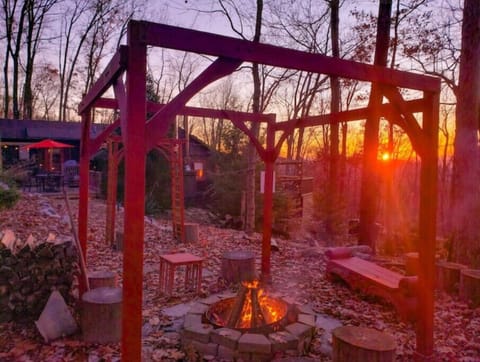 Outdoor fireplace with sunset valley views
