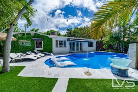Heated Pool & Lush fenced private back yard with water features, artificial turf, hammock, swings and Talum feel. 