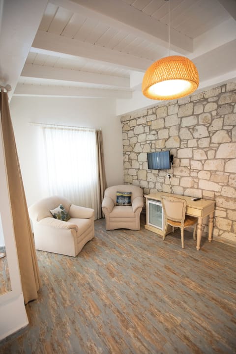 Superior Room with Garden View | Living area | 35-inch LED TV with premium channels