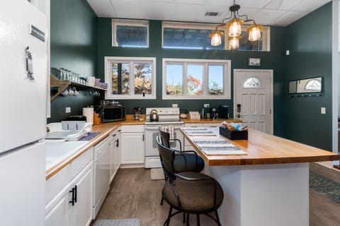 Modern lower-level kitchen with ample space and full amenities.