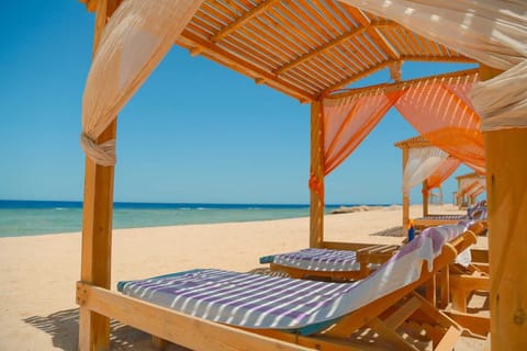 Private beach, white sand, sun loungers, beach umbrellas