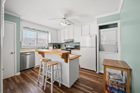The kitchen island provides additional counter space for serving snacks or meals