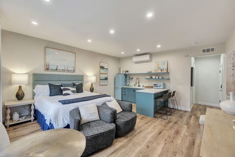 Bright studio w/ plush bed, cozy seating & a sleek kitchenette for easy, relaxed stays