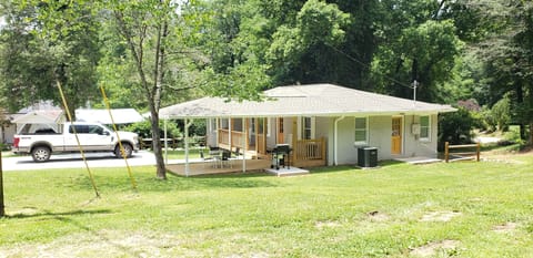 Outside View
Showing covered porch, sitting area, gas grill and large driveway 