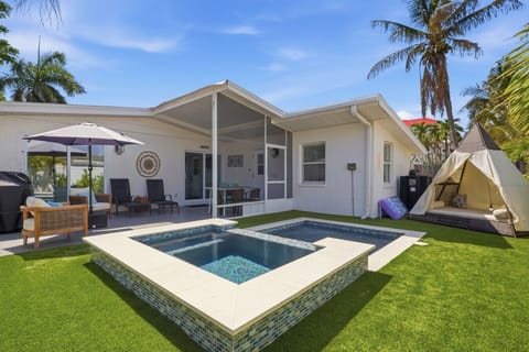 Backyard space w/ pool, spa and seating.