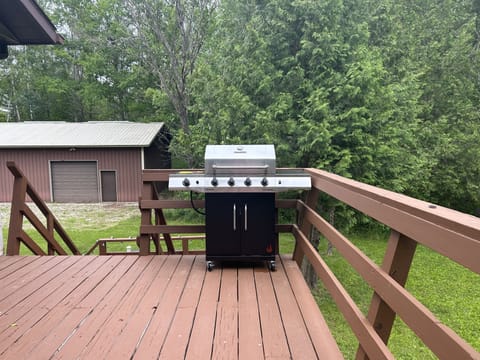 Gas grill with burner and large deck