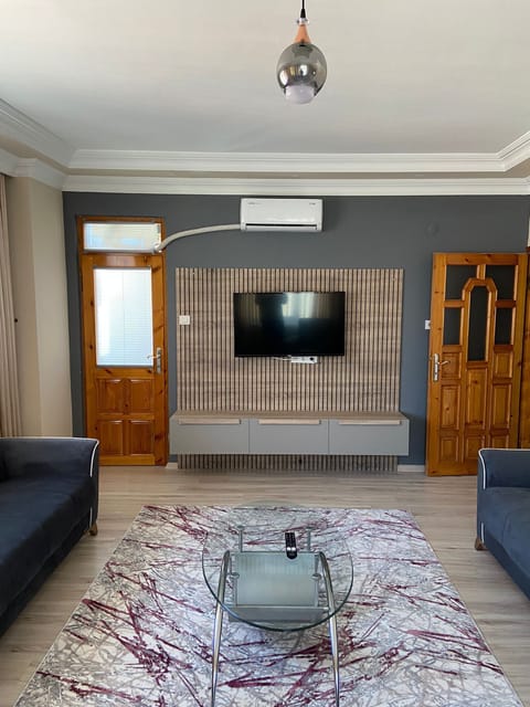 Comfort Apartment | Living area | 50-inch LCD TV with satellite channels, TV