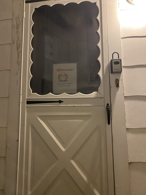Entrance to Vrbo unit with lock box on right side wall