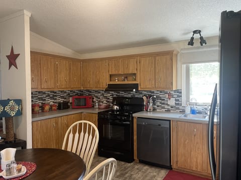 Another corner in the kitchen- microwave, toaster, oven & dishwasher…