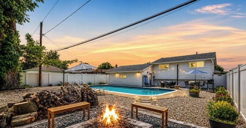 - Backyard firepit with wood seating for cozy evenings together   - Swim in the private pool surrounded by privacy fencing   - Sunset views create the perfect backdrop for gatherings  