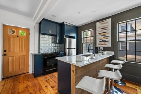 Newly remodeled kitchen with large bar perfect for dining