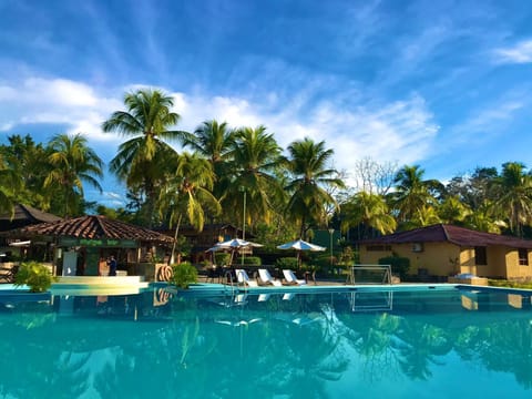 Outdoor pool, open 10:00 AM to 9:00 PM, pool umbrellas