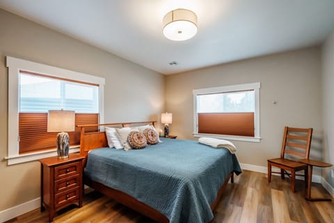 Enjoy natural light by day and room-darkening blinds for restful sleep on a king bed.