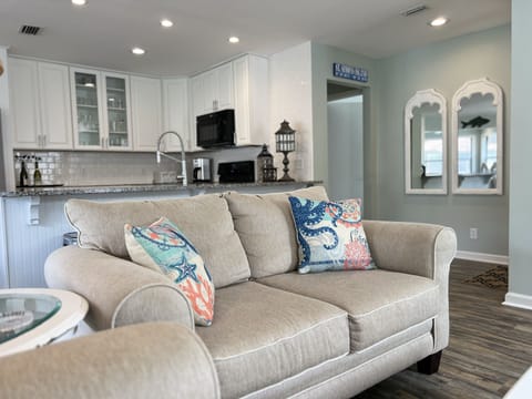 Another view of the open living and kitchen area.