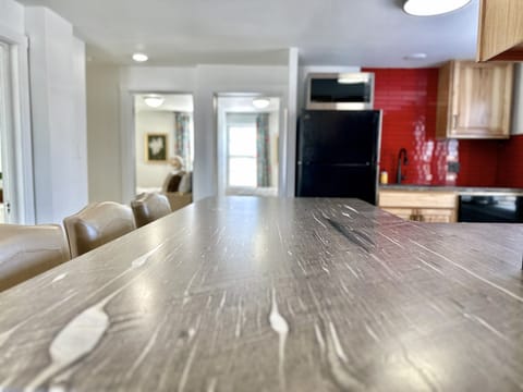 Handpicked granite tops this dining area adjoining the kitchen. 