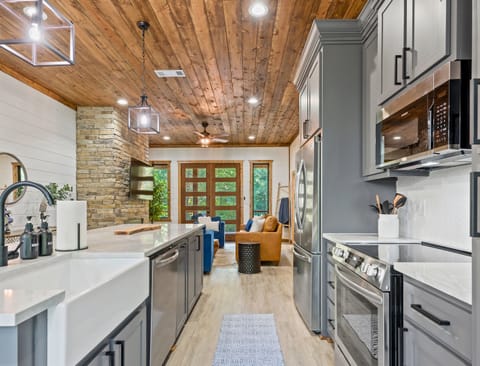 Stainless steel appliances and a large island make meal prep in this kitchen both efficient and enjoyable.