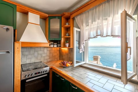 Villa | Private kitchen | Oven, electric kettle, toaster