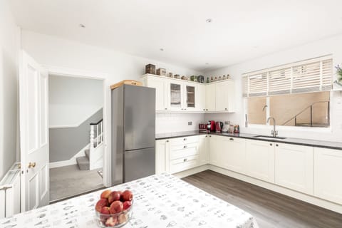 Spacious kitchen with double oven, dishwasher, washing machine and all utensils, plates, glasses to prepare a fine feast.