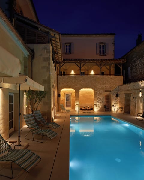 Seasonal outdoor pool, open 9:00 AM to 8:00 PM, pool umbrellas