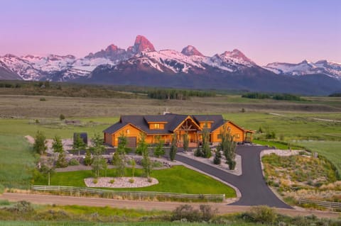 Early summer offers lush landscapes and snow-capped mountains at Elk Ridge.