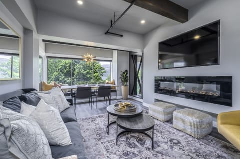 Comfortable living room anchoring two king suites on opposite sides of condo