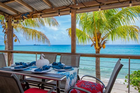 Enjoy a meal on the beautiful deck overlooking the beach.
